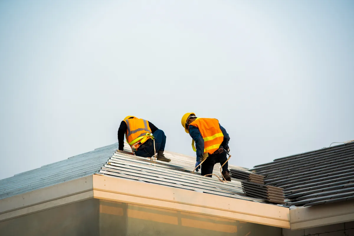 Experienced TruePro roofers completing a residential project
